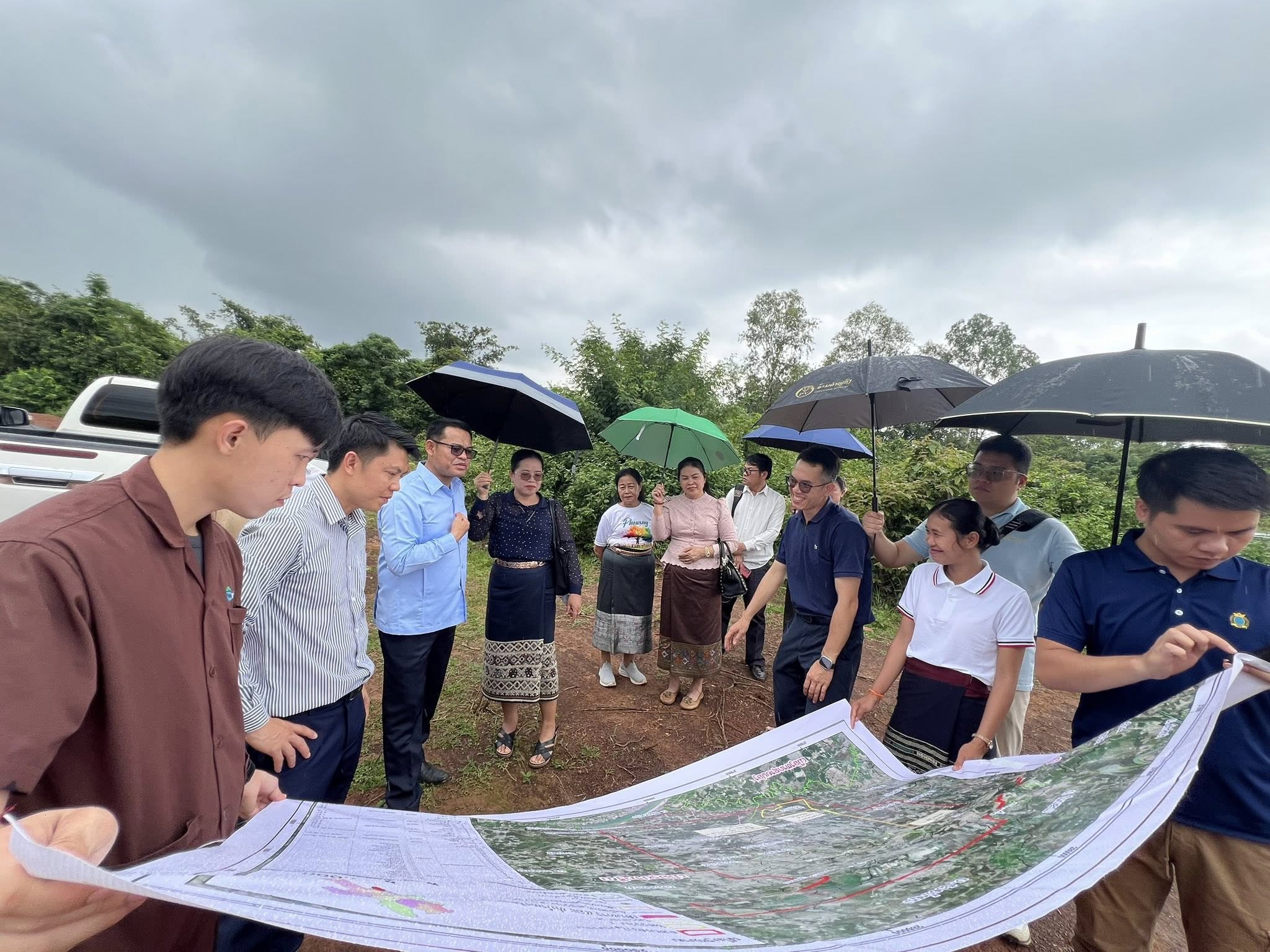 Field team reviewing project alignment maps on site